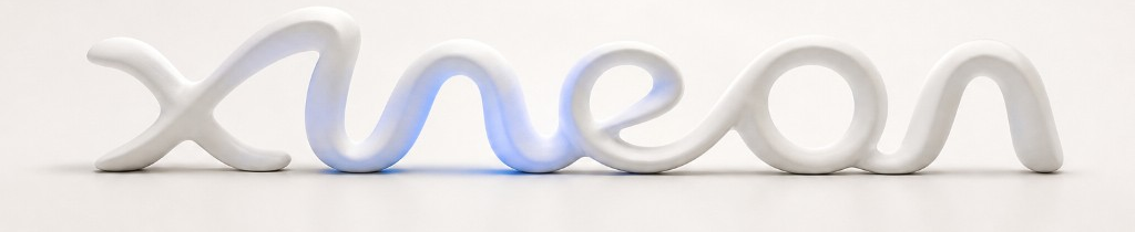 Xineon — white letterforms with a soft blue glow